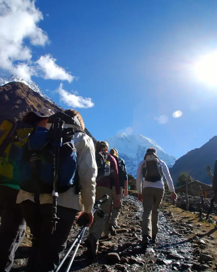 trekking hikers mountain sky blue