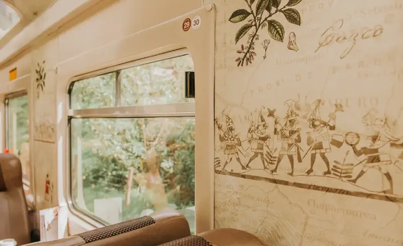 Interior details of the PeruRail Expedition train with Inca-inspired design.