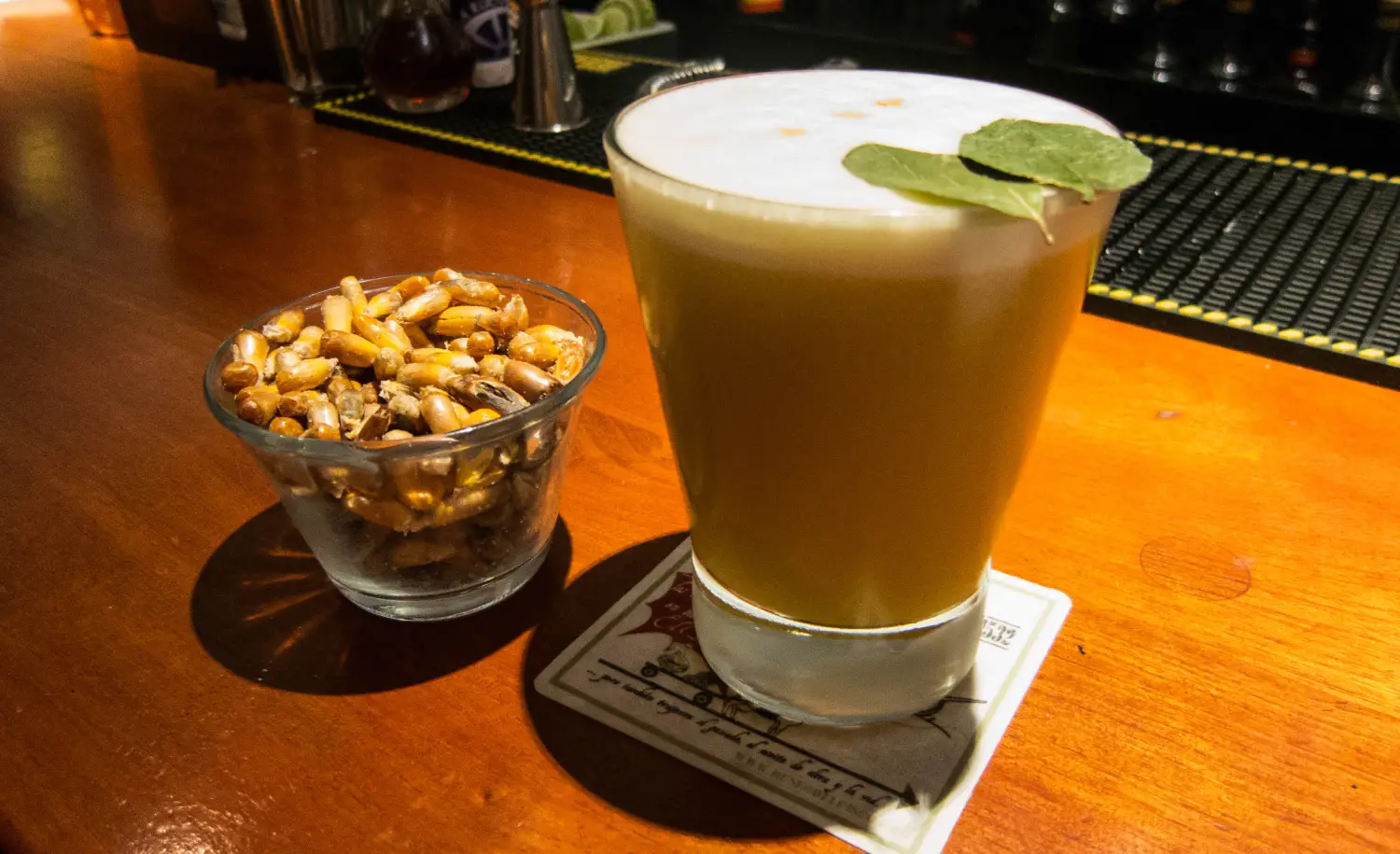 Macerated coca leaves in Pisco quebranta with lemon juice, gum syrup, egg white, ground coca leaves, ice.