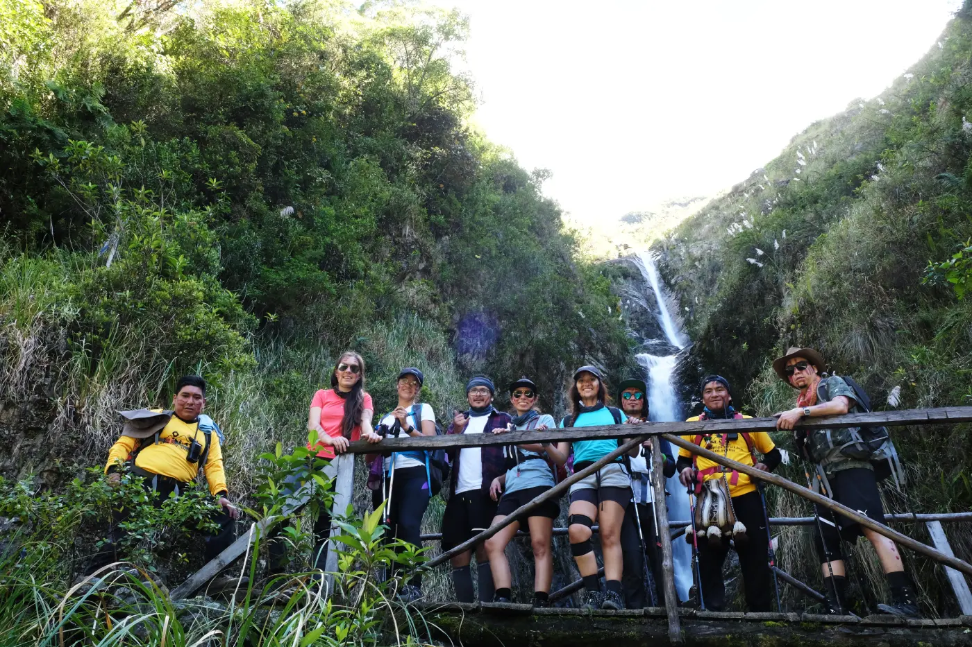 Trekking group at a waterfall stop along the lower Salkantay mountain route.