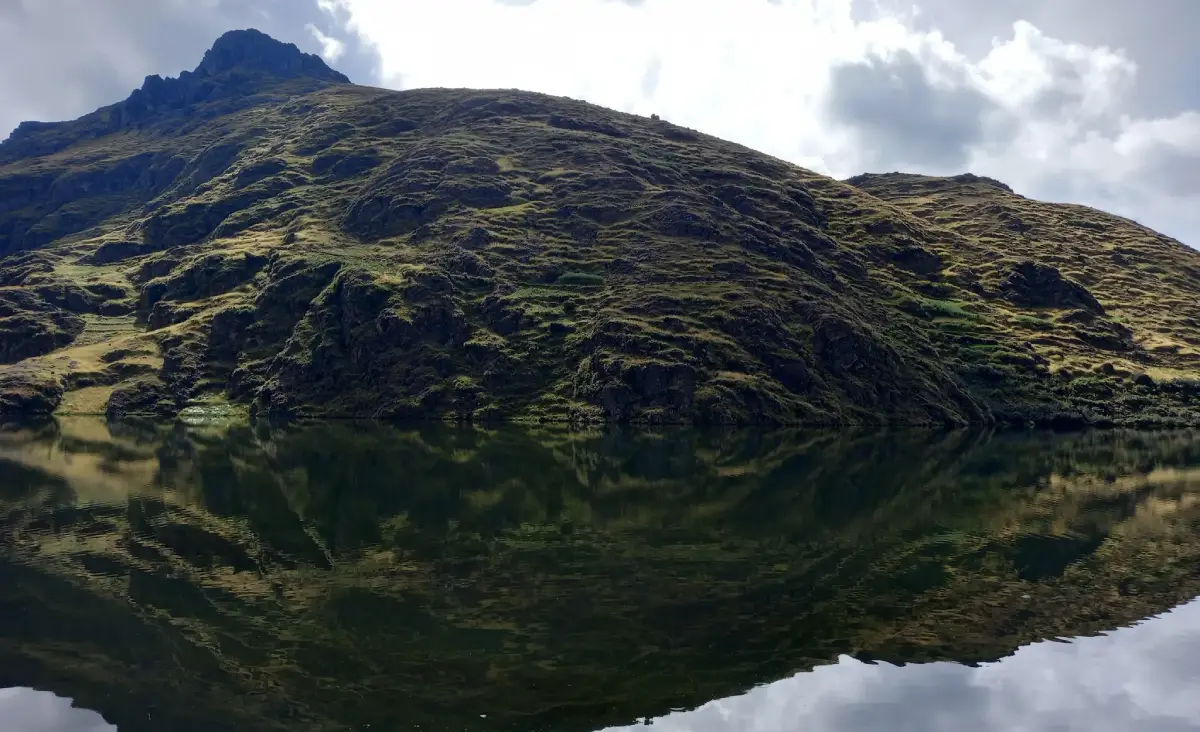 Pisac lakes. The reflection of sky and mountain in Kinsa Cocha lagoon