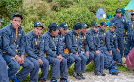 The Inca Trail porter team with Inkayni Peru Tours posing on the route.