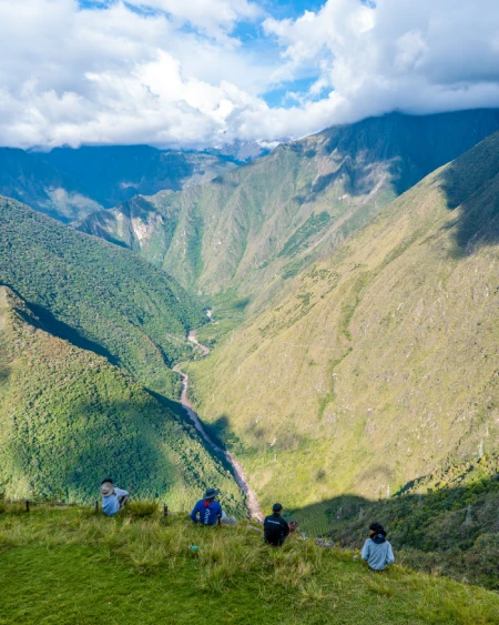 Travelers contemplating the landscape of the Inca Trail route