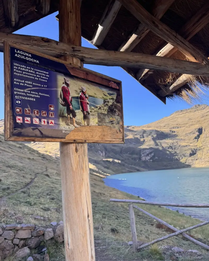 Wooden sign with information about Azul Cocha Lake