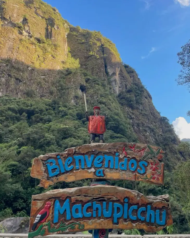 aguas calientes to machu picchu pueblo mountain sun vegetation welcome