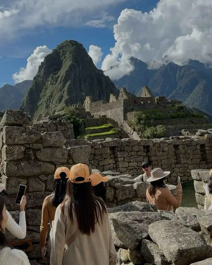 aguas calientes to machu picchu pueblo foreign tourists mountain stone path trail hike