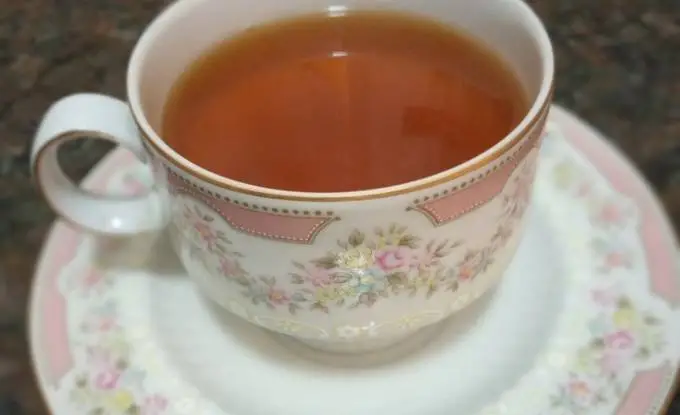Cup infused with ginger, lemon, and honey.