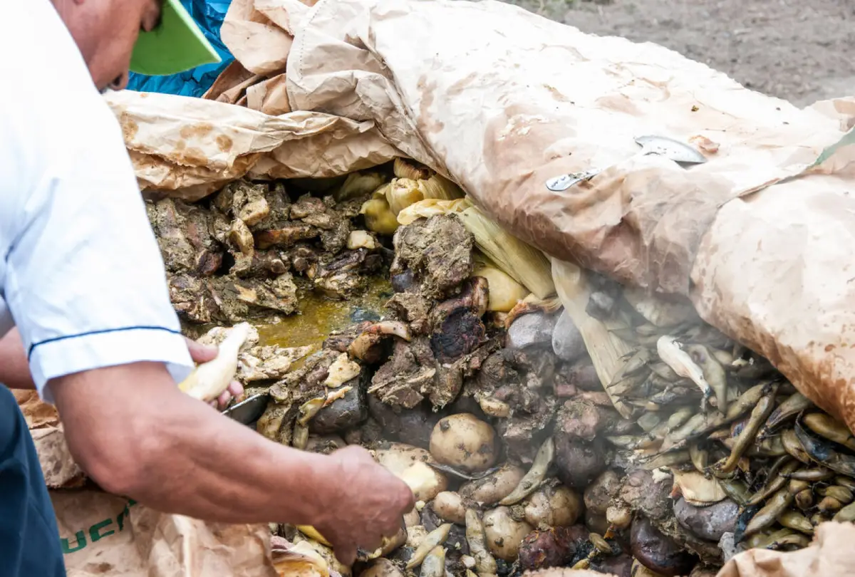 Traditional Andean dish cooked in an earth oven using hot stones, combining meats, potatoes and local ingredients.