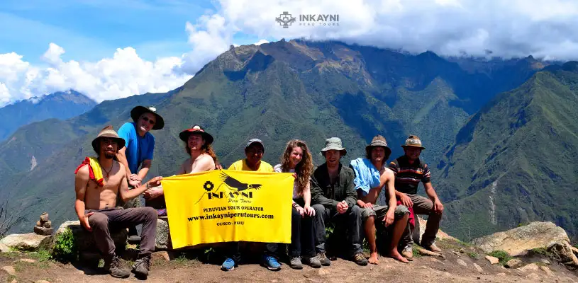 Trekkers arriving at Choquequirao Archaeological Park in Cusco Peru with Inca terraces above the Apurimac Canyon
