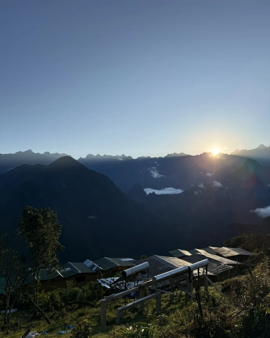 Sunrise over rural houses and mountains on the Choquequirao route