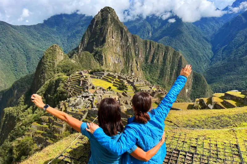 Travelers overlooking Machu Picchu
