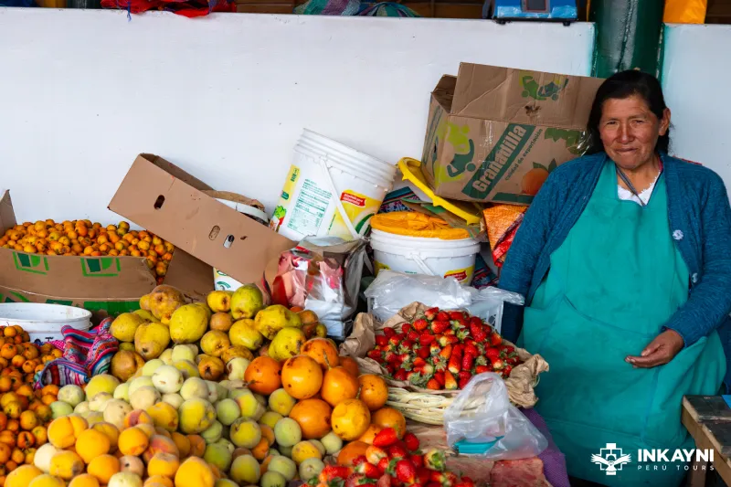 Friendly Fruit Seller at a Local Cusco Market (Inkayni Peru Tours)