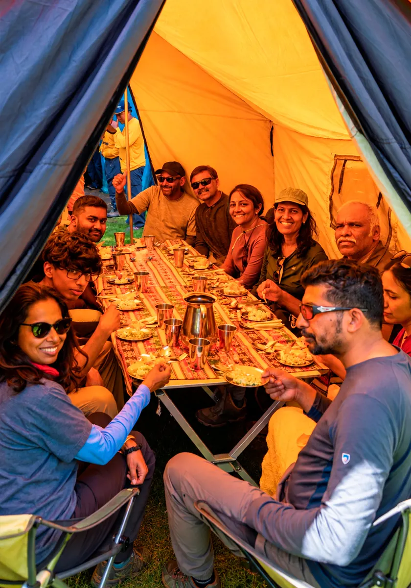 Travelers sharing a meal inside the dining tent during the Inca Trail journey