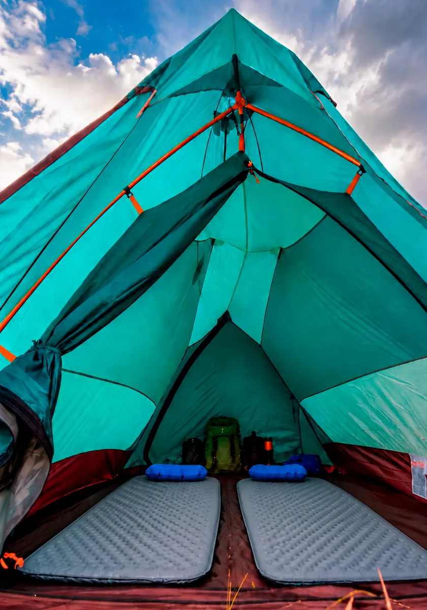 Interior of a premium camping tent with mattresses prepared for the Inca Trail trek